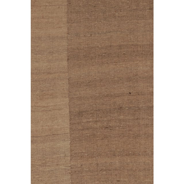 Handwoven in wool and originating from Persia circa 1950-1960, this oversized 12x28 vintage Persian extra-long kilim is...