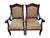 An elegant pair of French Provincial style mahogany armchairs featuring graceful cabriole legs, carved serpentine crest...
