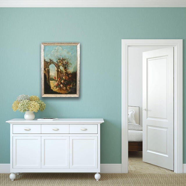 19th-century Italian oil on canvas painting. It is a classic still life, characterized by a rich composition. A lush,...