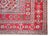 A playful early 20th century Anatolian Turkish rug with three large geometric medallion living amidst a field of stylized...