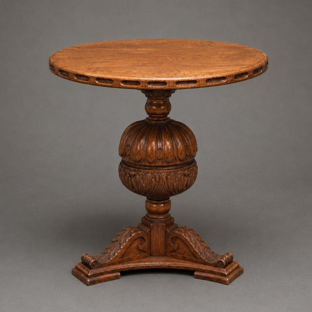 This 19th Century French Oak Carved Pillar Table showcases exceptional craftsmanship and timeless European character....