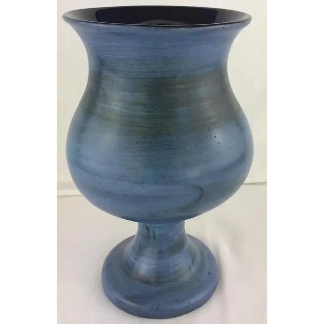 This elegant blue vase by Jean de Lespinasse features stylized friezes adorning its body. Signed "jdl," the piece...