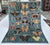 A captivating hand-knotted pictorial rug featuring an exquisite collection of over twenty individually rendered butterfly...