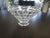 A substantial crystal vase featuring a stud like pyramid pattern all along it. Perfect for an extravagant floral...