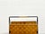 A beautifully designed vintage magazine rack with a black lacquered metal frame and warm, natural-colored woven wood. The...