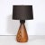 This elegant and sophisticated Mid Century Modern ceramic table lamp was realized in France, circa 1960. It features a...
