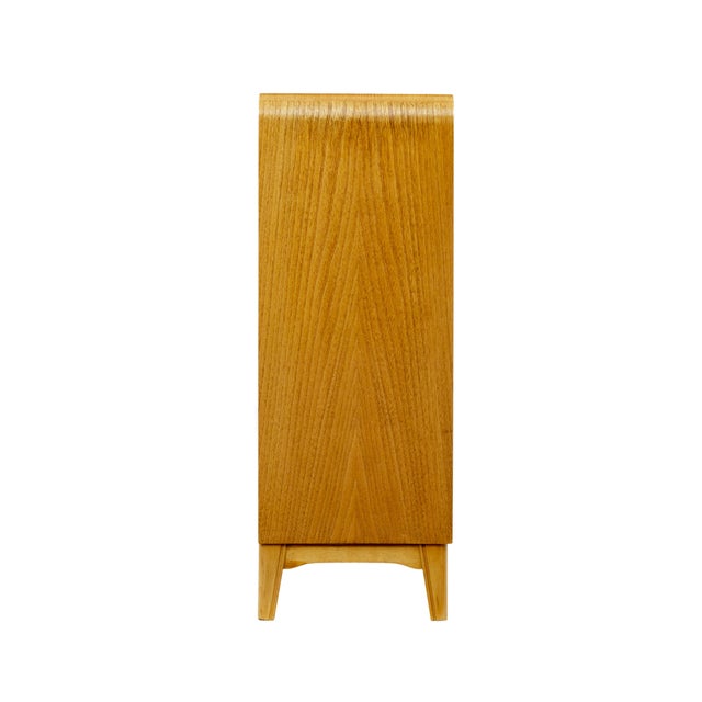 Scandinavian mid century elm and burr low open bookcase 1950. Fine example of a well known model by Swedish furniture...