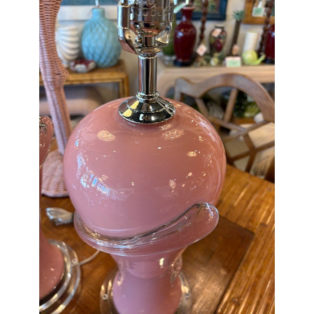 Vintage pair of Italian Murano pink glass table lamps. Newly wired, 3 way sockets, clear cords, nickel hardware, lucite...