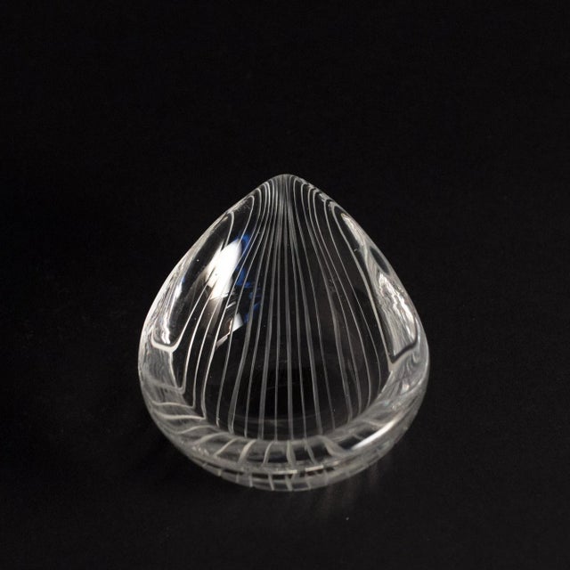 Exquisite, drop-shaped little “Kantarelli” bowl by Tapio Wirkkala. The glass is cut in a striped pattern on the outside,...