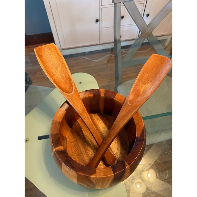 Vintage Dansk Jens Quistgaard teakwood salad bowl and tong set. Diameter: 9” Depth: 6”