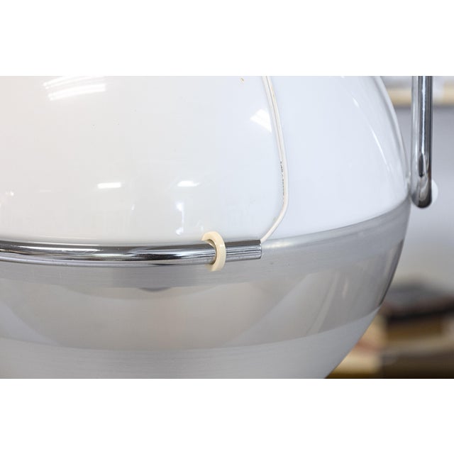 A vintage 1970s Fabio Lenci for Guzzini arc floor lamp. This chic arc lamp has a classic mid century styling for an...