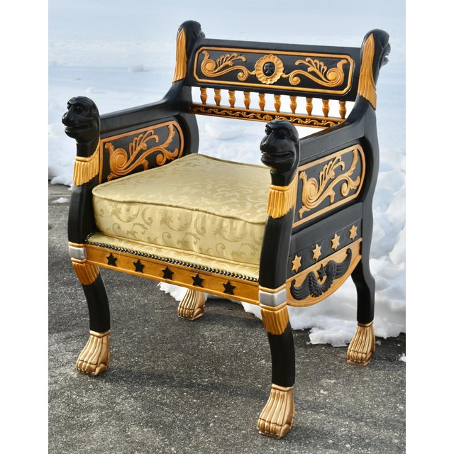 Vintage (1980's) Ornate Accent Chair has an Egyptian Revival Style. Ornate Wood Frame in a Black and Gold Finish with Lion...