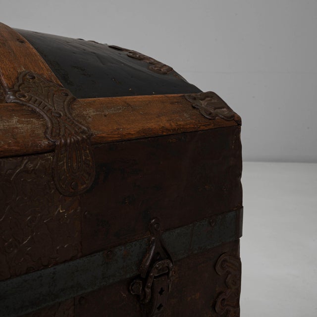 This 19th Century French wooden trunk is a classic example of utilitarian travel storage from the era, combining sturdy...