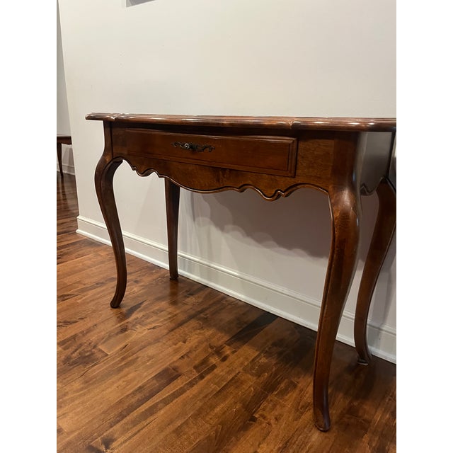 Ethan Allen Country French Single Drawer Console Table. This table features a serpentine-shaped apron, ornate bronze-toned...
