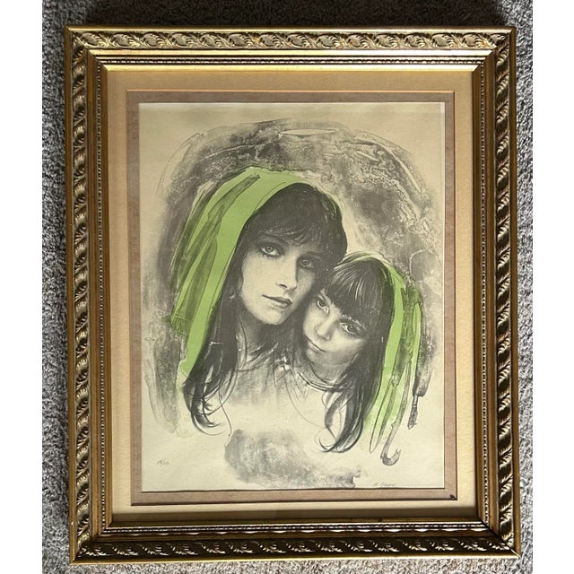 Vintage 1970’s lithograph in original gold frame. Image is of a mother and child. Signed to the lower left ‘M Maurice’ and...