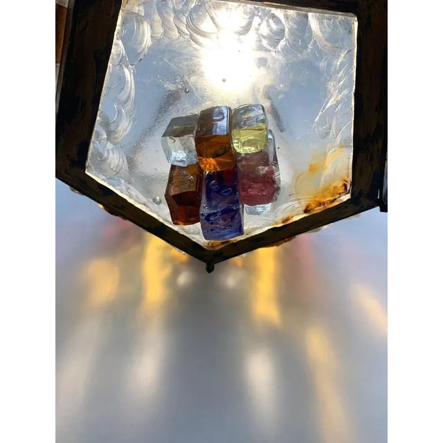 Excellent chandelier consisting of several hand built windows with a hand -wrought iron load -bearing structure. All the...