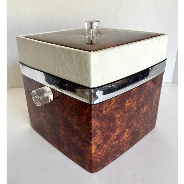 Here is a super retro chic, square shaped ice-bucket that features a faux burl-wood and white vinyl covering, with lucite...