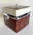Here is a super retro chic, square shaped ice-bucket that features a faux burl-wood and white vinyl covering, with lucite...