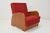 Amrchair that can be converted to a daybed. Made in Czechoslovakia in wood and fabric. The fabric shows signs of use....
