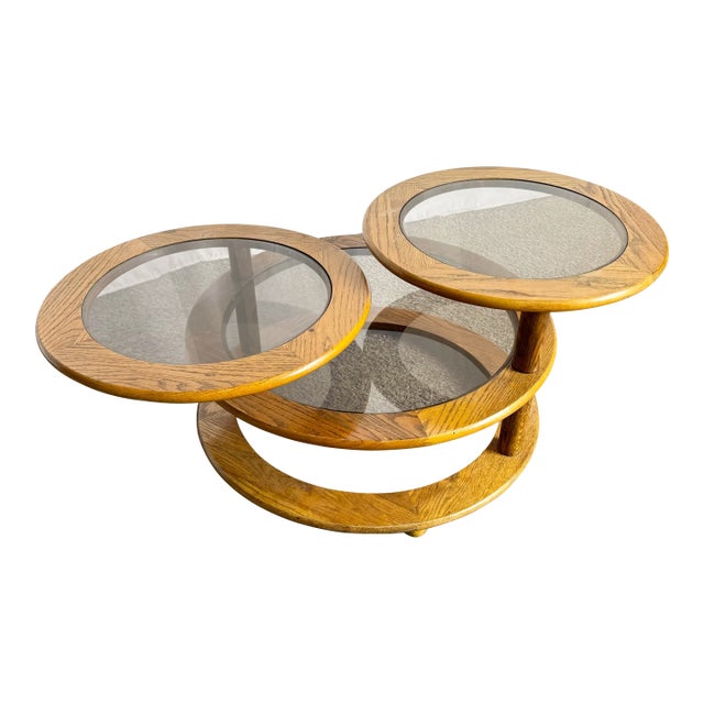 Mid Century Modern Three Tier Oak and Smoked Glass Swivel Coffee Table For Sale