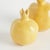 With a bright yellow glaze, uneven texture and organic form, these little pomegranate bud vases are simple and raw....