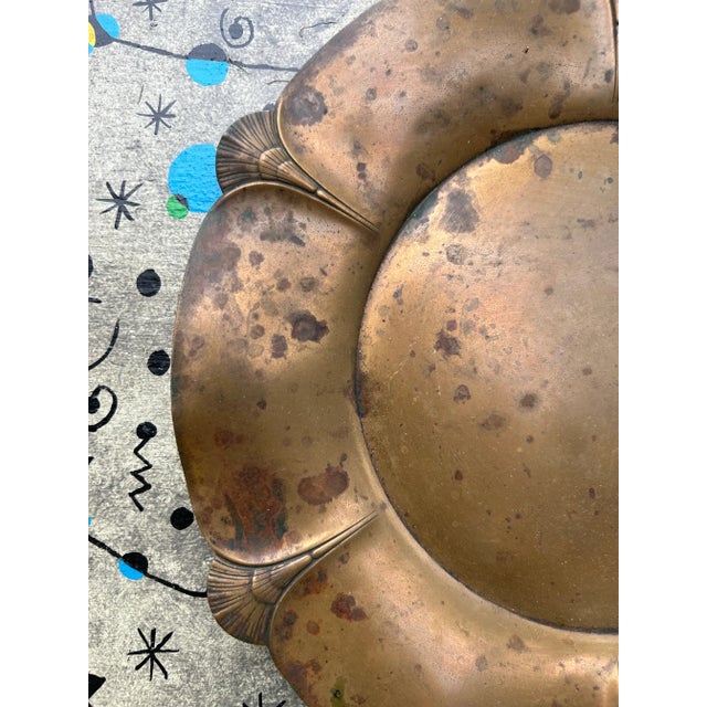 small Copper tray or plate. Beautiful imprinted art nouveau pattern around the perimeter. Manufacturers marks on bottom.