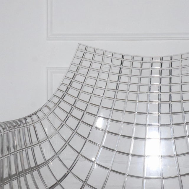 Modern pair of armchairs featuring a complex molded lucite shell atop a chrome base. Reminiscent of Bertoia. Attributed to...