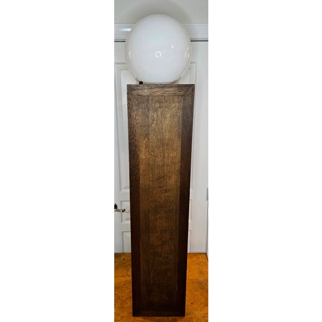 This Mid-Century Modern Globe on Column Floor Lamp is perfect for modern or traditional decor. Crafted with a solid...
