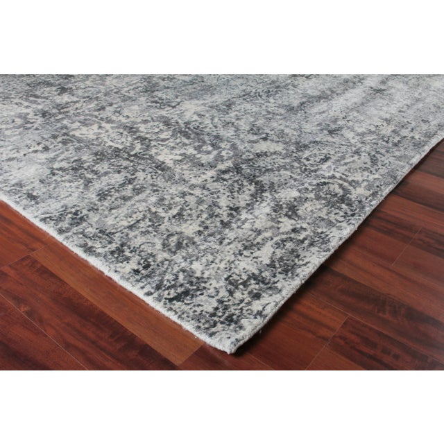 Unique splashes of color guide the eye through the Newport rug's spontaneous design. Handmade from the richest New Zealand...