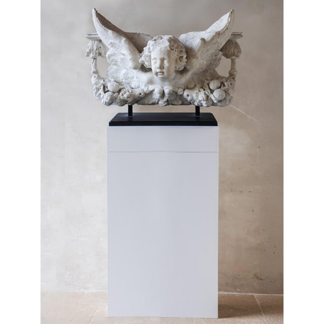 Marble statue of a putto, Italy, c. 1600, carrara marble. This statue of a putto is made of Carrara marble. The putto has...