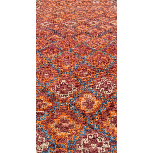 This Antique Baluch Runner has been hand-knotted and features an impressive all-over sub-geometric diamond design replete...