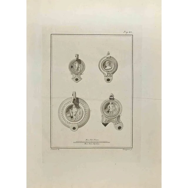 Hercules on Oil Lamp from "Antiquities of Herculaneum" is an etching on paper realized by Francesco Giomignani in the 18th...