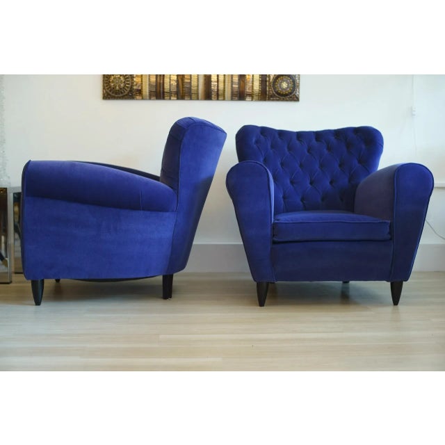 A pair of large armchairs with velvet upholstery designed by Gugliemo Ulrich and made in Italy. This piece is attributed...