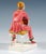 Very rare goldscheider ceramic figurine. The young lady with a blonde page-boy hair cut is wearing pink pajamas with blue-...