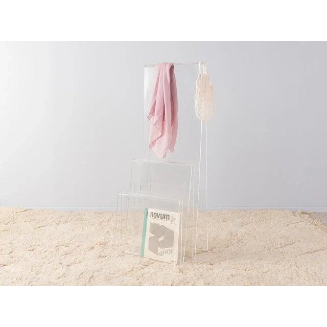 Unique clothing rack from the 1960s. High quality frame made of transparent acrylic. Quality features: very good...