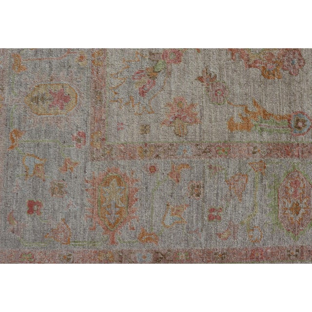 Measures: 9'3 x 12'3 Our Elegant Angora Turkish Oushak Rug brings a touch of timeless beauty and sophistication to any...