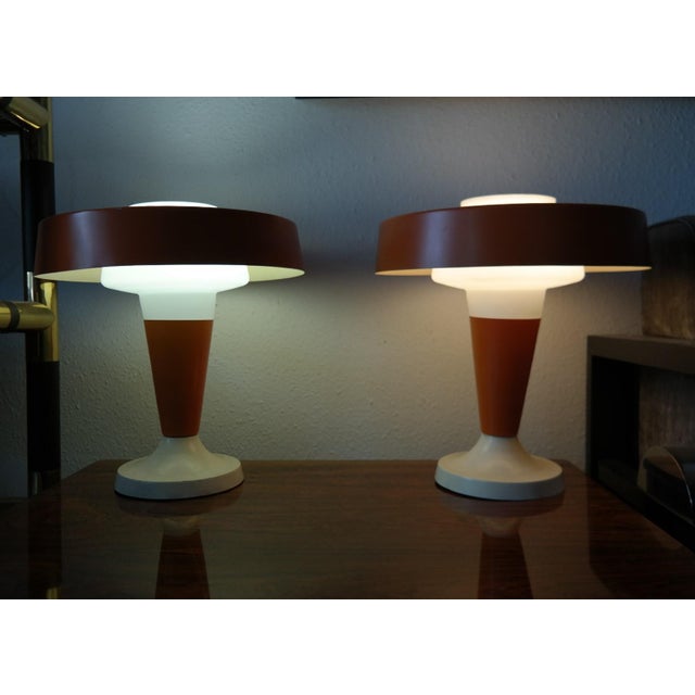 Decorative vintage design lamp pair from the 1960-1970s with opal glass shades and orange plates. Dimensions: 40x35x35cm...