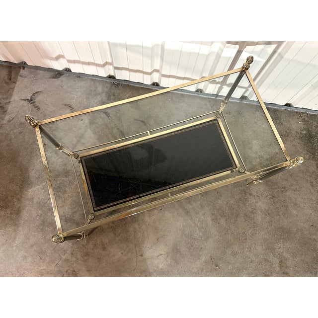 Neoclassical style bronze coffee table circa 1970s attributed to maison jansen. Double glass and black leather top (used...