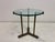 A refined late 20th Century side table by Peter Ghyczy combining a sculptural metal base with a floating glass top. The...