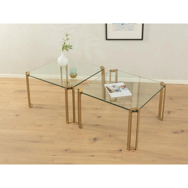 Wonderful coffee tables, model T 24, from the 1970s by Peter Ghyczy. High-quality brass feet and table top made of 11mm...
