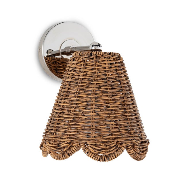 The Kismet Hanging Sconce is a perfect fixture for any room with a sweet, simple design and woven rattan-like shade. And...
