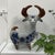This ceramic figurine represents the rich tradition of Mexican folk pottery. The blue floral motifs and hand-painted...