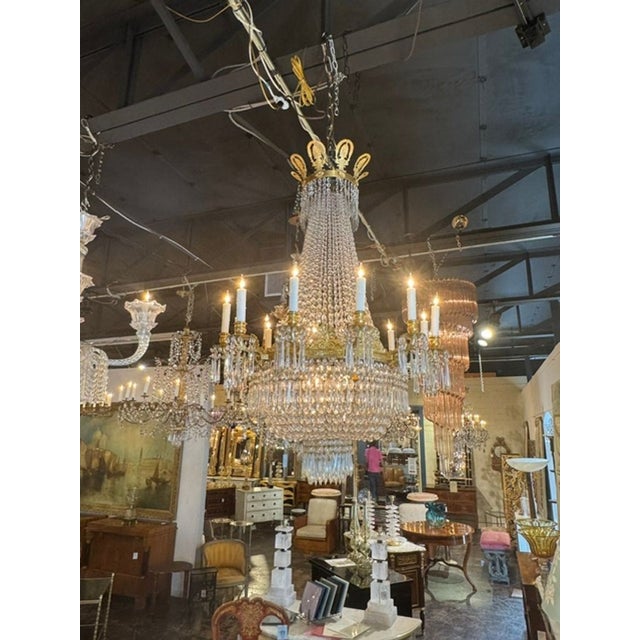 This 19th century French Empire bronze and crystal chandelier is a luxurious and elegant lighting fixture. The intricate...