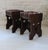 Pair of solid wood stools, Brutalist design, 20th-century French craftsmanship. The seats are upholstered in braided...