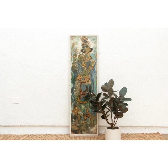 This mid-20th century painting of Krishna, depicted in a serene standing pose as he plays his flute, radiates a...