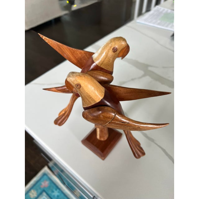 Pair of carved wooden parrots on a branch. The sculpture has a danish modern feel. The parrots are made of at least three...