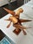 Pair of carved wooden parrots on a branch. The sculpture has a danish modern feel. The parrots are made of at least three...