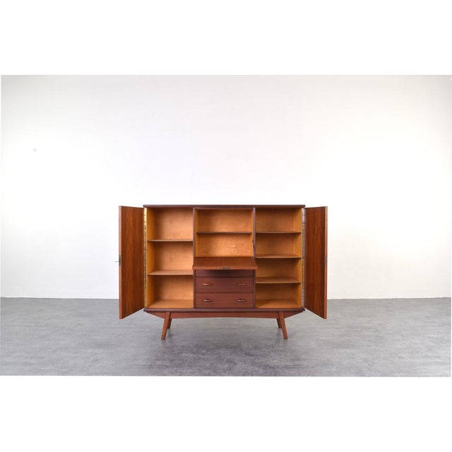 This teak highboard was made in Denmark in the 1960s. The furniture has been professionally and carefully restored by...