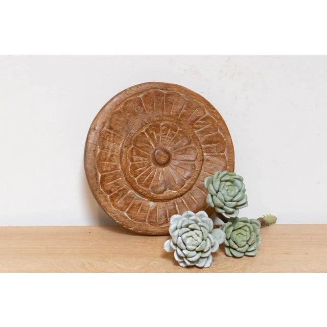 This finely carved vintage chapati plate, handcrafted from wood, brings a touch of global charm to your home. Originally...