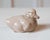 A charming porcelain duckling by Royal Copenhagen, renowned for its exceptional Danish craftsmanship and delicate...